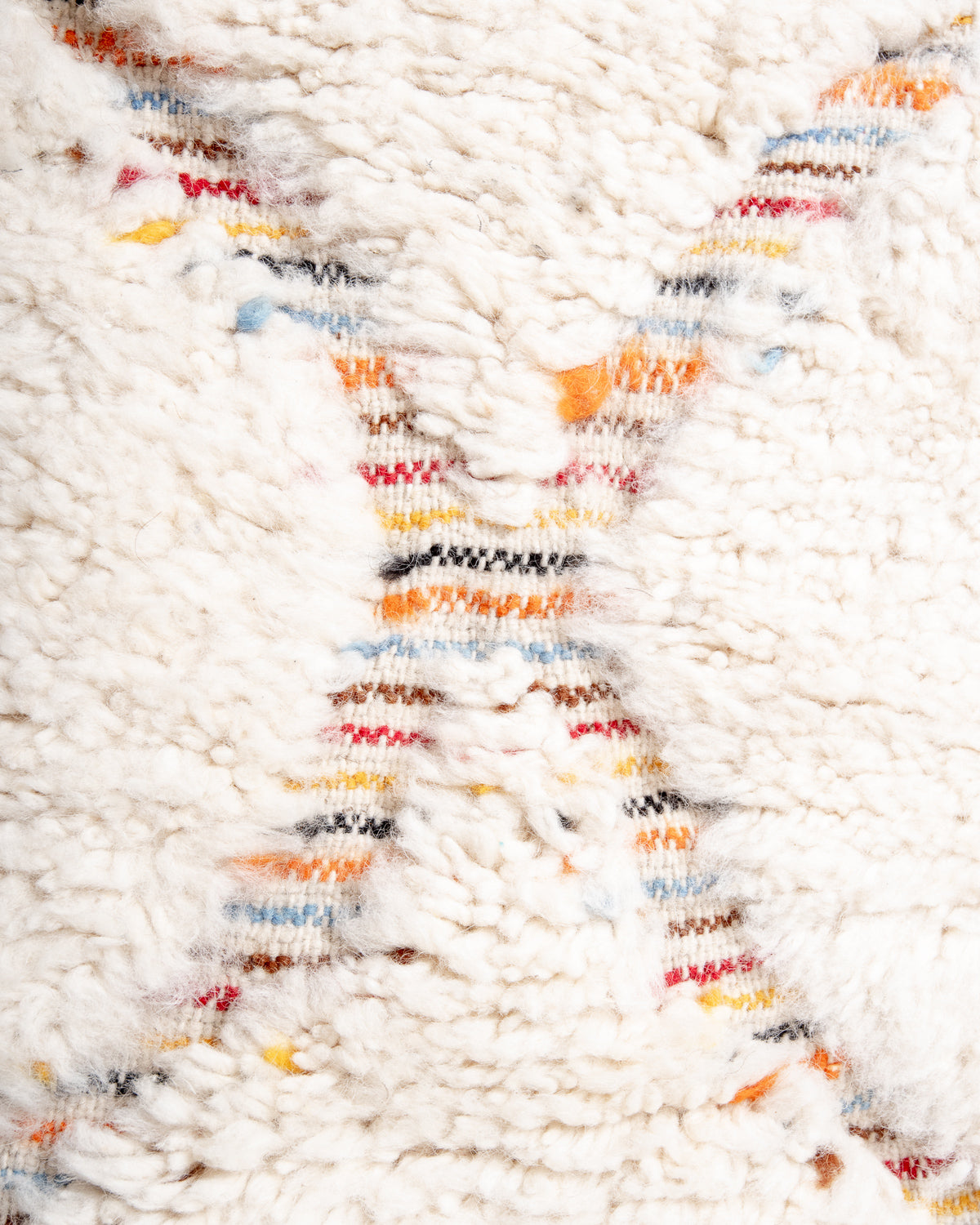 Modern, designer, handcrafted Berber rug from Morocco. Beniourain carpet with beautiful colours and patterns and fluffy wool texture.
